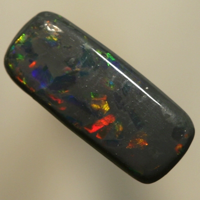 SOLID BLACK OPAL Sparkles of red between blues with a touch of gold